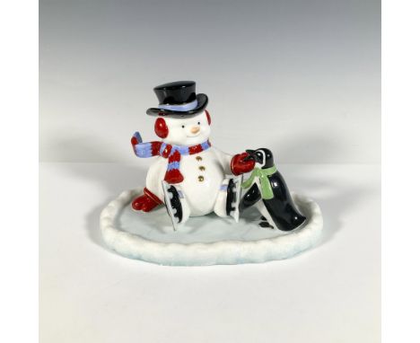 Limited edition figure. Features a smiling, seated snow man on a patch of ice wearing a top hat, ice skates and a scarf that 