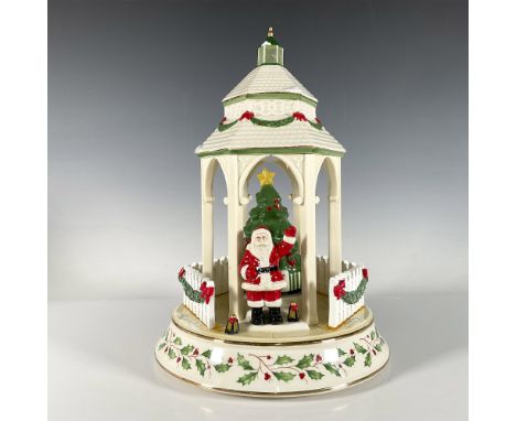 Crafted from fine ceramic and hand decorated, this electric centerpiece features Santa and a Christmas tree with changing lig