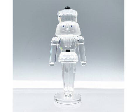 Part of the Exquisite Accents collection. Features a lead crystal nutcracker standing to attention with blue crystal eyes, fr