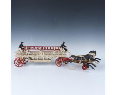 Vintage piece recreating the original fire department crew with ladders being pulled by three horse team. Cast iron colored i