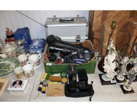 A collection of various cameras to include Minolta, Practika, an aluminium case and various accessories