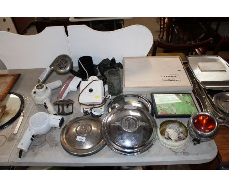 A Lyra artists box, a collection of vintage hairdryers sold as collectors items, three hub caps, a vintage bell box, a US Arm