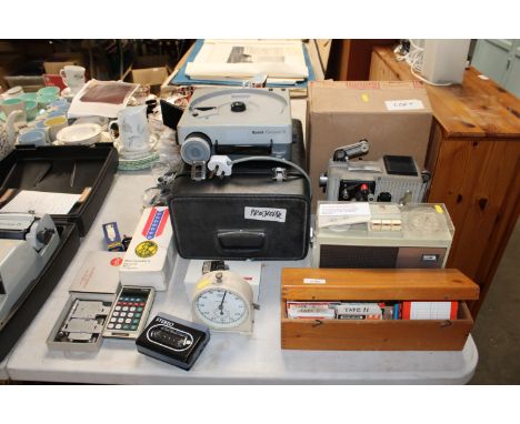 A Kodak carousel projector together with a Eumig projector, a Philips radio sold as a collectors item, a Smiths clock, a Comm