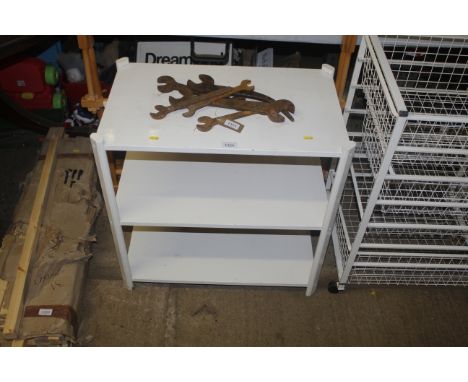 A three tier white painted wooden shelf unit