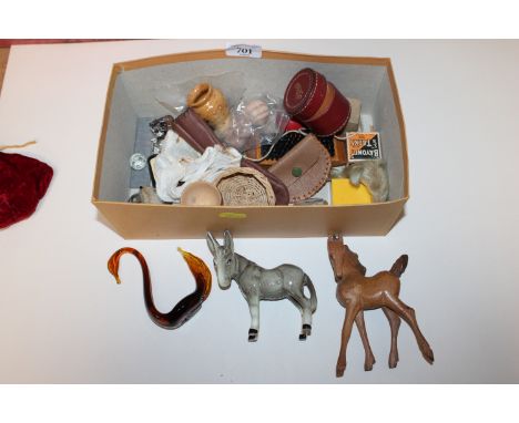 A box containing various miscellaneous items to include a glass figure of a swan, a model of a donkey AF, coinage, cufflinks 