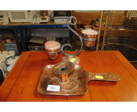 A copper chamber stick, a copper and wrought iron plant holder