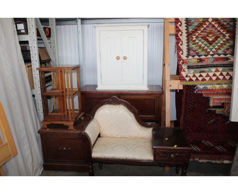 A reproduction revolving bookcase, a Victorian commode, a side table fitted cupboard doors, a side cabinet and a reproduction