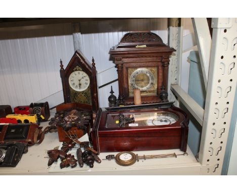 An oak cased three hole mantel clock, a Black Forest style clock together with two others