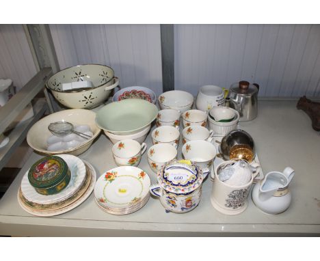 A collection of various decorative items to include floral decorated tea set, an enamel colander, pottery twin handled pot an