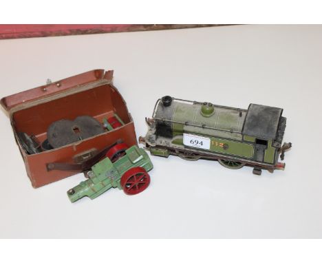 A tin plate model of a Bassett-Lowke and Hornby Series style train, a model of a steam roller AF, various coinage etc.