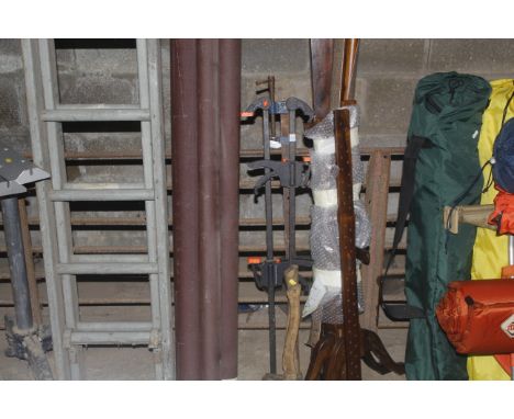 A metal sash clamp, two quick release clamps and two hand held axes