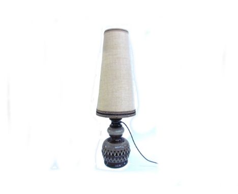 A West German Pottery floor lamp, twin bulb, with mottled brown glazes, original shade. Overall height 95cm. (Collectors Elec