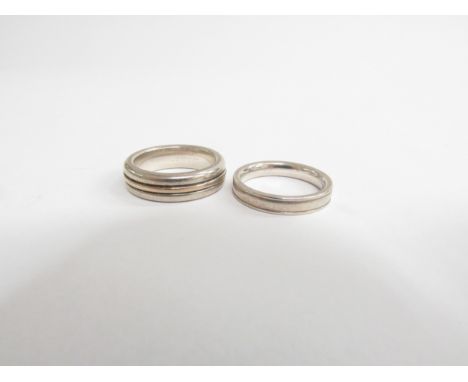 Two 925 sterling silver contemporary rings in modernist design, both sized around Q/R 