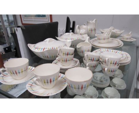 A collection of Midwinter "Cherokee" pattern dinnerwares designed by Jessie Tait to include coffee cups and saucers, milk jug