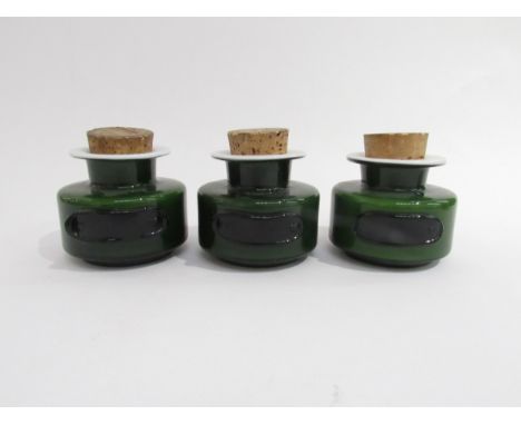 Three Holmegaard cased green glass spice jars with cork lids.  7cm high without cork. 