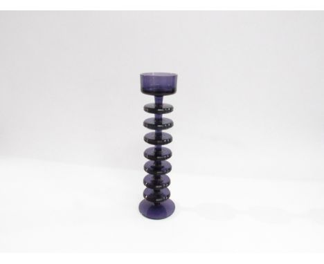 A Wedgwood Glass seven ring Sheringham candle holder by Ronald Stennett-Willson in amethyst. 27cm high 