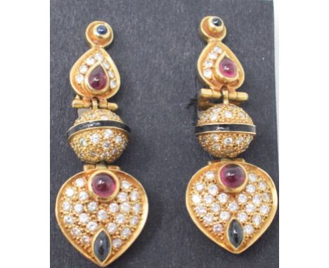 A pair of yellow coloured metal gem set drop earrings, with sapphire and ruby cabochons, brilliant cut diamonds and enamel de