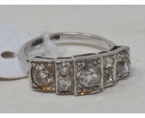 An Art Deco style platinum and seven stone diamond ring, approx. ring size K½ See illustration

Report by NG

It is approx. 4