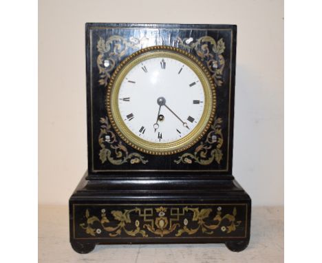 A late 19th century French mantel clock, the 11 cm diameter enamel dial with Roman numerals, fitted an eight day movement, in