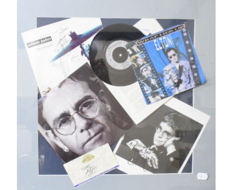 Elton John interest: a signed Wrap Her Up sleeve and single, a signed photograph, a signed concert ticket and other ephemera,
