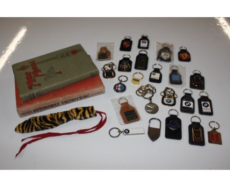 A 25th Edition of The Motor Manual, one other Motor Manual and a collection of various car related key fobs