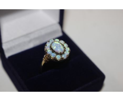 A silver gilt and opal set ring