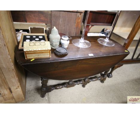 An Ercol style oak gate leg coffee table