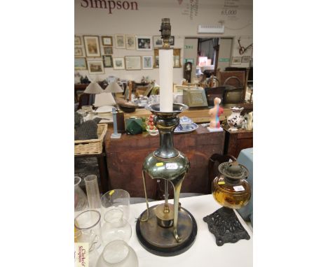 A large decorative brass table lamp