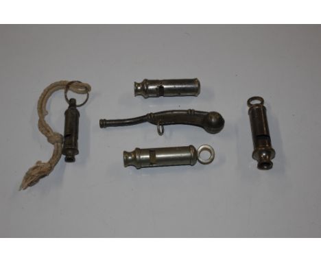 A World War II ARP whistle, a military broad arrow Hudson whistle, a bosun's whistle with broad arrow and two others