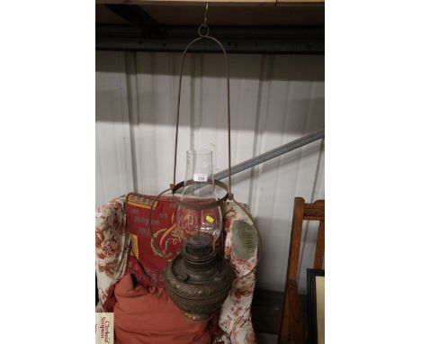 A Victorian American brass and metal ware hanging oil lamp