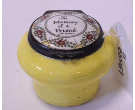 An 18th century enamel box, the cover inscribed In Memory of a Friend, losses and cracks to enamel, 6 cm diameter