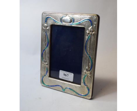 An Art Nouveau style silver and enamel photo frame, 14 cm wide   Condition report  Modern