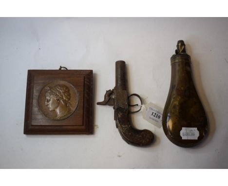 A 19th century percussion cap muff pistol, a copper powder flask, and a French medallion (3)