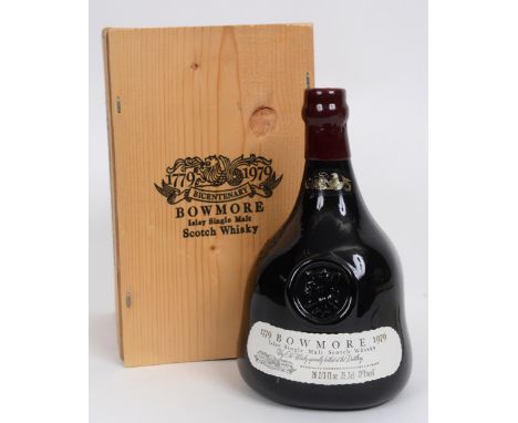 A bottle of Bowmore Islay single malt whisky, bi-centenary limited edition no G201, in a replica hand blown decanter with the