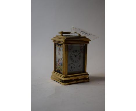 A miniature carriage clock, decorated ceramic panels, 5 cm wide   Condition report  ModernReport by GHHeight with handle down