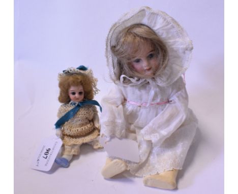 An Armand Marseille bisque head doll, with fixed blue eyes and open mouth exposing four teeth, inscribed 1894/AM 7/0, DEP/Mad