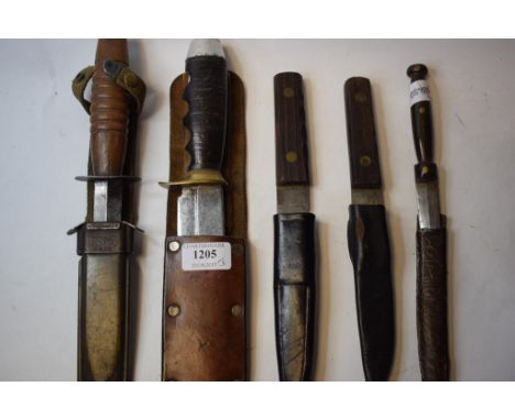 A Geo Wostenholm & Son fighting knife, in an associated US Mk 8 bayonet scabbard, a Bowie knife and scabbard, and three other