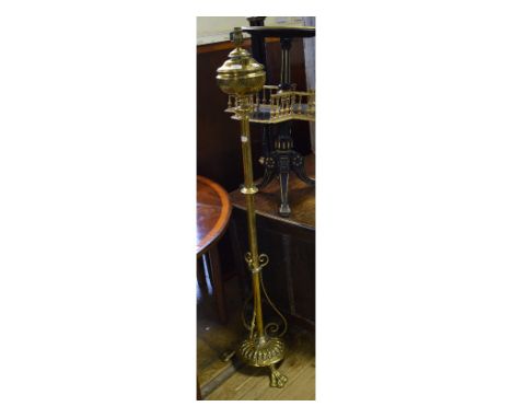 A Victorian brass standard lamp, converted to electricity, 140.5 cm high (including fitting) 