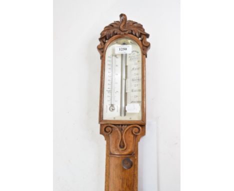 A Victorian stick barometer, the ivory register signed T Newman, 122 Regent Strt London, in an oak case, 101 cm high