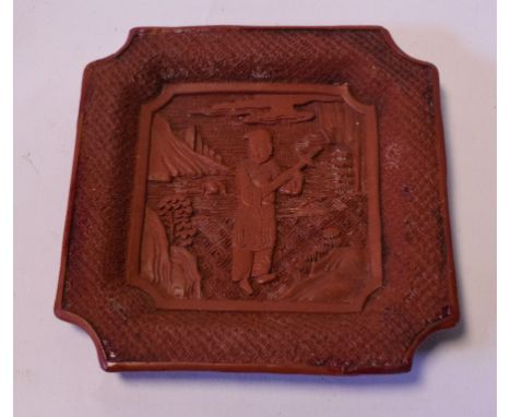 A Chinese red cinnabar lacquer dish, repaired, 11 cm wide, a group of Chinese mother of pearl gaming counters, and other item