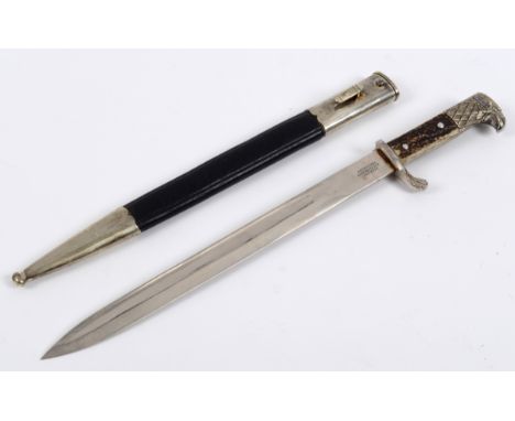 A German police bayonet, with an antler mounted handle, the blade stamped WEYERSBERG KIRSCHBAUM & CIE, Solingen, with a scabb