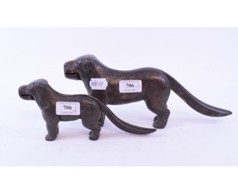 A cast iron nutcracker, in the form of a dog, the handles stamped PATENT NO 273480, 31 cm wide, and another, 22 cm wide (2)