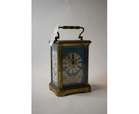 A brass carriage clock, later decorated blue porcelain panels, 15 cm high (over handle)   Condition report  Modern