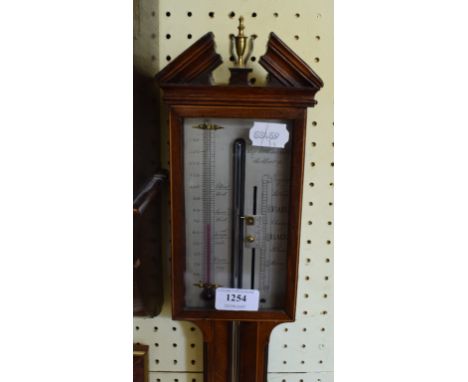 A George III style inlaid mahogany stick barometer, with a silvered dial, 96 cm high