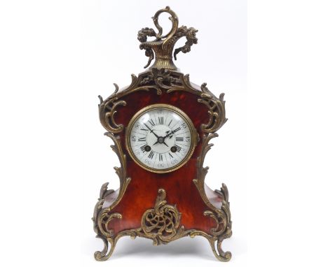 A Louis XVI style clock, the 8.5 cm diameter enamel dial with Roman numerals, signed Maples Co Ltd, Paris, fitted an eight da
