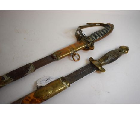 A late 19th/early 20th century Chinese short sword, the blade 42 cm, in a tortoiseshell and brass mounted scabbard, damages a