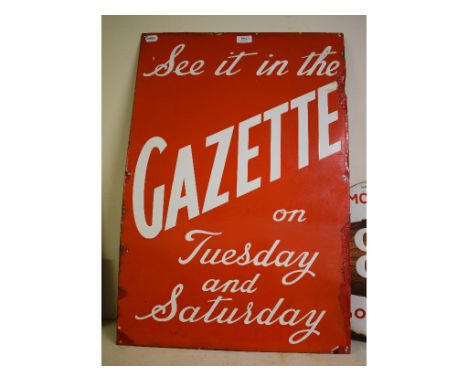 An enamel advertising sign, See it in the Gazette on Tuesday and Saturday, 76 x 51 cm, and a circular enamel advertising sign