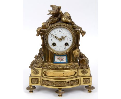 A French mantel clock, the white enamel dial with Arabic numerals and painted roses, fitted a Schmoll 1253 movement, striking