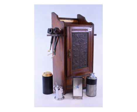 A Dunhill table lighter, in the form of a tankard, 8.5 cm high, other lighters, a smoker's cabinet with pipes, an onyx ashtra