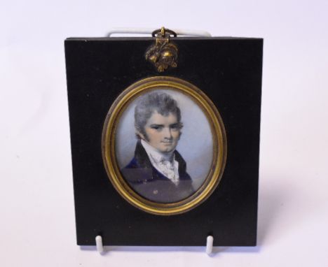 A 19th century oval bust portrait miniature, of a gentleman, watercolour, 7 x 6 cm, another oval portrait miniature of a lady